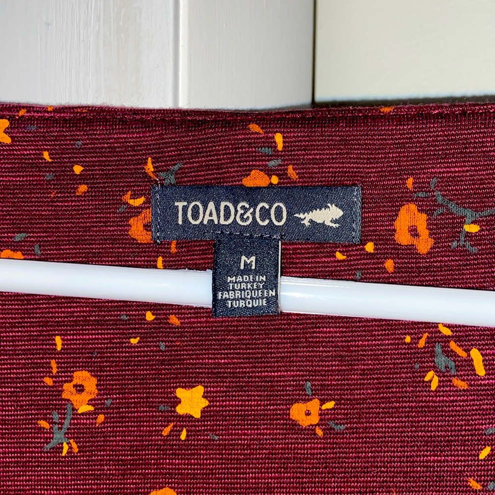 Toad and Co. medium. Maroon with mustard colored flowers. 3/4 length sleeve.